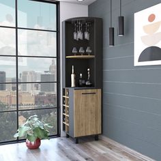 a room with a large window and a tall cabinet filled with liquor bottles on top of it