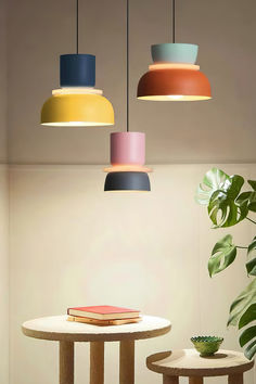 We at Mooijane present the Lucie Macaron Pendant Light, featuring a unique color-blocking design. This Nordic-style lamp adds a touch of modernity to your interiors. Its multi-layered lampshade not only adds style but also versatility. This acrylic colorful bowl-shaped lampshade chandelier combines form and function.