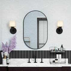 a bathroom with two sinks and a large mirror