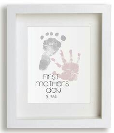 a baby's hand and foot print in a white frame