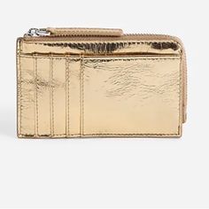 Our Leather Bag And Accessory Collection Is Cool, Modern And Quietly Luxe. This Streamlined Metallic Wallet Has Four Card Slots, A Large Front Slip Pocket And A Top Zip To Secure Loose Change And A Key Or Two. It's So Good, It's Essential. Leather. Zip Closure. Card Holder Pockets. 3"H X 5"W X 2"D. Gold Bifold Coin Purse With Card Slots, Compact Gold Wallet With Interior Card Slots, Gold Wallets With Card Slots For Daily Use, Gold Wallets With Rfid Blocking For Formal Use, Gold Rfid Blocking Wallets For Formal Occasions, Luxury Gold Coin Purse With Card Slots, Luxury Gold Wallet With Rfid Blocking, Gold Formal Wallets With Rfid Blocking, Compact Gold Wallet For Everyday Use