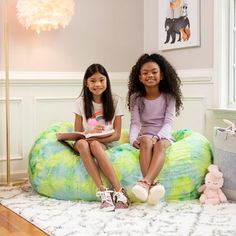 There's no better match for fluffy relaxation and fun playdates than the product. The soft yet supportive bean bag couch fits two kids, making it perfect for after-school video gaming. The product also lends well to quiet reading time, acting as a mini, body-hugging daybed when children layout on it. More than just cuddly, the product is convenient for parents; the incredibly soft faux fur cover is removable and machine-washable for easy cleaning so you can stay worry-free during arts and crafts Faux Fur Bean Bag, Fur Bean Bag, Bean Bag Couch, Bean Bag Lounger, School Video, Toddler Swimsuits, Mom Planner, Bean Bag Sofa, Buy Sofa