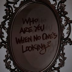 a mirror with writing on it that says who are you when no one's looking?