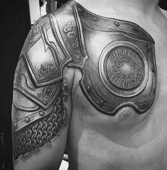 black and white photo of a man's chest with armor on it