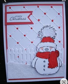 a handmade christmas card with a snowman wearing a red hat and scarf on it