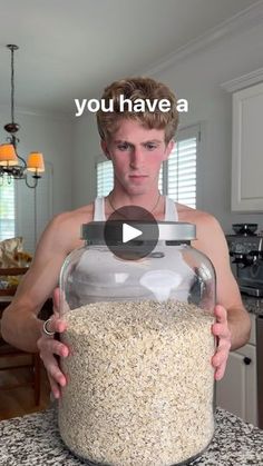 a man holding a large jar filled with oats in front of him and the caption you have a