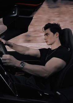 a man sitting in the driver's seat of a car with his hand on the steering wheel