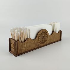 toothbrushes in wooden holder on white background