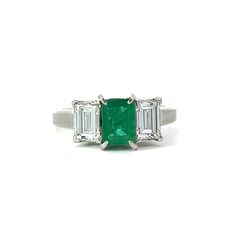 This Emerald, Diamond and Platinum Three Stone Ring features a stunning emerald stone set in a classic three stone design of diamonds and platinum. A perfect choice for an engagement ring that exudes sophisticated elegance and timeless style. Jewelry Style : RingMetal Type : PlatinumEmerald : 1 Emerald Cut Emerald, approximately 0.74 Ct.Diamonds : 2 Emerald Cut Diamonds, approximately 0.80 ctw Color G-H, Clarity VSApproximate Weight : 4.77 gramsStamped "074 080 PT900"Ring Size : 5estate piece Three Stone Ring, Jewelry Style, Emerald Stone, Stone Design, Emerald Cut Diamonds, Three Stone Rings, Emerald Diamond, Style Jewelry, Three Stone