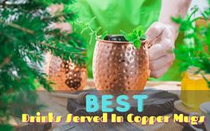 a person holding a copper cup with plants in it and the words best drinks served in copper mugs