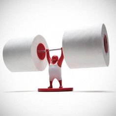 a red and white figurine holding two rolls of toilet paper