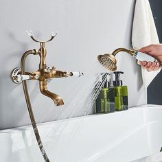 a person is spraying water from a faucet