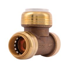 an image of a brass plated valve with nozzles on the top and bottom