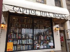 a book store with lots of books on the front and shelves full of books in it