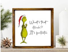 the grinch is holding an umbrella in front of a white background with pine branches