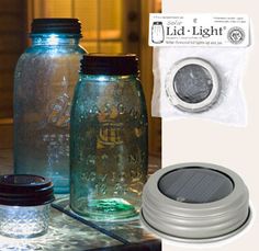 three mason jars with lids and lids are sitting on a table next to each other