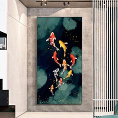 a living room with a painting on the wall and koi fish swimming in it