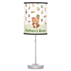 a lamp with a teddy bear on it and the name, nursery's room