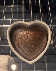 a heart shaped chocolate cake in the oven