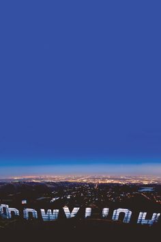 an airplane flying over the city at night