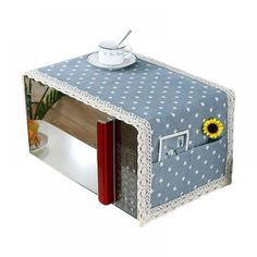 a blue and white box with a sunflower on it