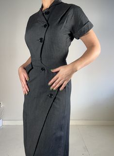 This dress is classic, and it has a beautiful fit. I sourced this is San Francisco. It's in perfect condition, not a button out of place. I believe the dress is 100% cotton. Please reach out with any questions.  Measurements Shoulder: 14 inches Sleeve length: 7 inches  Waist: 13 inches Hip: 18.5 inches Length: 42 inches Bottom opening: 22 inches PLEASE READ MEASUREMENTS *All items are measured flat. Measurements are not doubled.* EXCHANGE/STORE CREDIT ONLY Please view return policy DISCLOSURE Some items have been professionally cleaned and altered. Photos and measurements reflect the current state of the item. All additional care is the responsibility of the buyer. Fitted Knee-length Dresses With Buttons, Fitted Vintage Dress For Semi-formal Occasions, Classic Fitted Vintage Dress For Workwear, Fitted Vintage Dress With Buttons For Workwear, Fitted Button Dress For Daywear, Classic Fitted Vintage Dress For Formal Occasions, Elegant Vintage Dress With Button Closure For Work, Fitted Dresses With Button Closure For Work, Fitted Vintage Short Sleeve Dress For Work