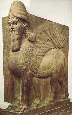 an ancient statue of a sphinx with wings on it's back and head in the shape of a lion