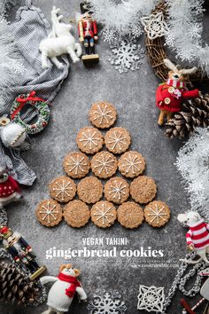 ginger cookies arranged in the shape of a christmas tree on a table with other decorations