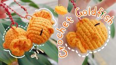 two crocheted goldfish keychains hanging from a chain with the words golden fish on it