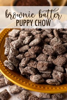 brownie batter puppy chow is on a yellow plate and next to some chocolate chips