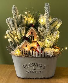 a potted plant with lights in it that says flowers and garden