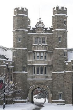 an old castle with snow on the ground