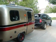 an rv is parked next to a truck