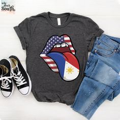 Introducing our stylish and comfortable Bella Canvas 3001 t-shirt, featuring a bold American Filipino design. This shirt is the perfect way to show off your pride for both cultures. Made with high-quality materials, this shirt is soft and breathable, making it perfect for everyday wear. The vibrant design is sure to turn heads and spark conversations. Get your American Filipino shirt today and add a unique touch to your wardrobe! .: Retail fit .: 100% Soft cotton (fibre content may vary for diff Trendy Short Sleeve Independence Day T-shirt, Trendy Short Sleeve T-shirt For Independence Day, Multicolor Graphic Print Tops For Independence Day, Trendy Short Sleeve T-shirt With Flag Print, Multicolor Flag Print Casual T-shirt, Casual Pre-shrunk Independence Day T-shirt, Casual Independence Day Pre-shrunk T-shirt, Independence Day Casual Pre-shrunk T-shirt, Casual Pre-shrunk T-shirt For Independence Day