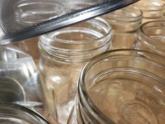 many jars are lined up on the table