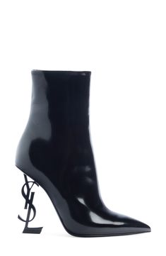 Saint Laurent's sophistication is taken to staggering new heights on a pointy-toe patent bootie balanced on an interlocking YSL-logo heel. 4 1/4" (107.95mm) heel (size 36.5) 5 1/2" shaft Leather upper, lining and sole Made in Italy Women's Designer Shoes Luxury Patent Leather Heeled Boots For Evening, Sleek Glossy Boots For Evening, Sleek Glossy Finish Evening Boots, Modern Fitted Patent Leather Heeled Boots, Elegant Formal Boots With Glossy Finish, Elegant Glossy Finish Boots For Formal Occasions, Elegant Glossy Finish Formal Boots, Luxury Patent Leather Evening Boots, Luxury Patent Leather Boots For Evening