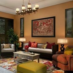 a living room filled with lots of furniture next to a window covered in blinds and shades