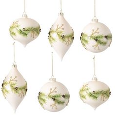 four white christmas ornaments hanging from strings