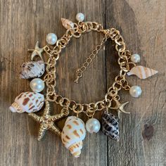 Seashell Charm Bracelet in Gold Jewelry Kit Shell Charm Bracelet, Seashell Charm Bracelet, Charm Bracelet Making, Bracelet Making Kit, Jewelry Kit, Beading For Kids, Beachy Jewelry, Bracelet Kit, Gold Link Bracelet