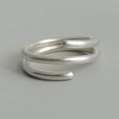 Sterling Silver Coil Ring Simple Band Wrap Ring Minimalist Jewelry Minimalist Sterling Silver Adjustable Bypass Ring, Sterling Silver Midi Rings With Modern Twist, Minimalist Spiral Stackable Rings, Minimalist Spiral Rings For Everyday, Minimalist Spiral Sterling Silver Ring, Minimalist Sterling Silver Spiral Ring, Minimalist Stackable Bypass Ring With Open Band, Minimalist Silver Bypass Ring With Open Band, Minimalist Adjustable Bypass Ring