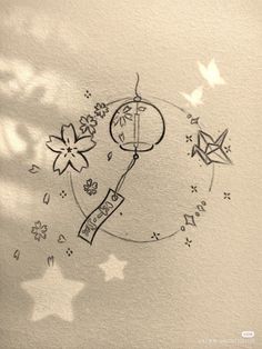 a drawing of a clock with flowers and stars around it