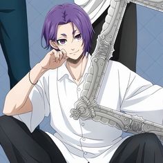 a man with purple hair sitting in front of a mirror and holding his hand to his face