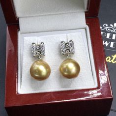 We are presenting you A PERFECT PAIR OF VIVID GOLDEN SOUTH SEA PEARLS! WITH EXCELLENT LUSTER. Accented with 20 pieces or superb quality, F/VS sparkling diamonds. SET IN HANDCRAFTED, 18K SOLID WHITE GOLD SCREWED BACK EARRINGS. IN CASE OF RETURN FOR US BUYERS. BUYERS MAY SEND THE ITEMS BACK TO OUR US-BASED OFFICE IN SALT LAKE CITY, UTAH ONLY ONE ITEM AVAILABLE!! NO DUPLICATES!! WHAT YOU SEE IN THE PICTURES IS WHAT YOU WILL GET SOLIDLY HANDCRAFTED EARRINGS! SUGGESTED RETAIL VALUE: $3,880 PEARLS: Si Gold Pearl Earrings With Diamond Accents, Gold Brilliant Cut Pearl Earrings For Anniversary, Luxury Gold Pearl Earrings With Diamond Accents, Luxury Gold Round Bridal Earrings, Luxury Round Pearl Earrings For Wedding, Luxury Pearl Earrings With Diamond Accents As Gift, Wedding Estate, Sea Wedding, Golden South Sea Pearls