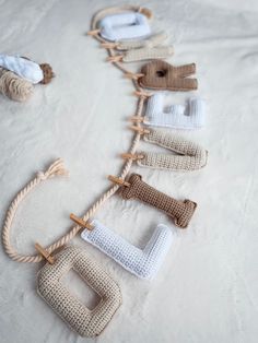 there are many knitted items on the bed together, including socks and yarns