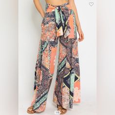 Olivaceous Palazzo Pants Wide Leg Front Tie Flowy Pant Loose Fit Size Medium And Large Bohemian Multicolor Print Bottoms For Vacation, Orange Wide Leg Beach Pants, Orange Printed Pants For Summer, Orange Bohemian Wide-leg Pants, Bohemian Orange Wide-leg Pants, Bohemian Multicolor High-waisted Pants, Orange Wide-leg Beach Pants, High Waist Orange Beach Pants, Orange High-waisted Bottoms For Vacation