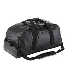 a black duffel bag sitting on top of a white floor