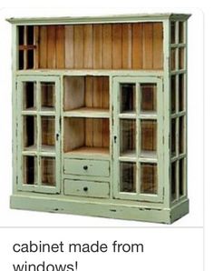 an old green bookcase with glass doors on the front and bottom, is shown