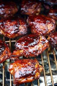 bbq ribs covered in barbecue sauce cooking on a grill