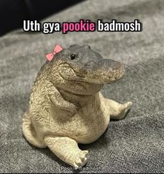 a fake toad sitting on top of a bed with the caption'uth gay pookiie badmosh '