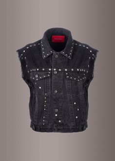 Your style will scream with the raucous rock 'n roll attitude when you are in this fierce black denim vest! The sleeveless jacket is made from black denim and has an oversized fit. The denim vest also features a fold-over-collar, all over studs, front button closure and a frayed hem along the armpits. Trimmed like a trucker jacket and mashed up with rock n roll swagger, this denim vest is your new fave layering piece. Available in sizes S, M and L. Made out of 100% cotton. Let your inner rebel g Studded Denim Vest, Denim Vest Oversized, Black Denim Vest, Sleeveless Jean Jackets, Club Jacket, Black Lace Choker, Oversized Vest, Punk Clothing, Motorcycle Club